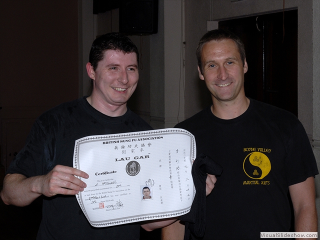 Stephen McDowell receiving his Black Sash and certificate from Sifu Derek Dawson