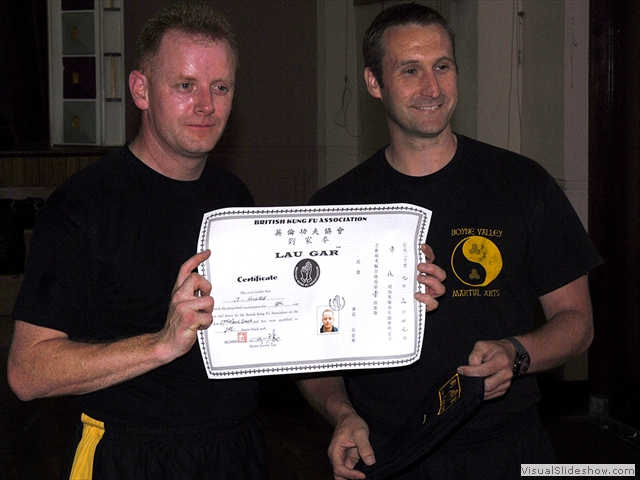 John Hughes receiving his Black Sash and certificate from Sifu Derek Dawson