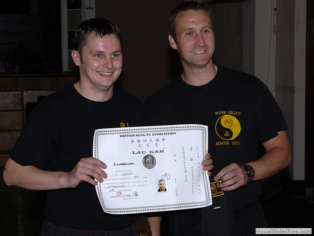 Ian Lafford receiving his Black Sash and certificate from Sifu Derek Dawson