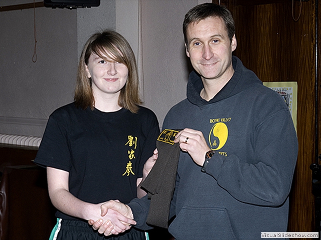 Laura Wallace receiving her Brown Sash from Sifu Derek Dawson