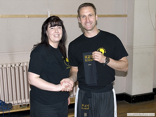 Catriona Farrell receiving her Black Sash from Sifu Derek Dawson