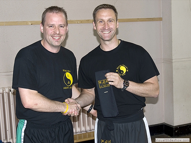 Frank Burton receiving his Black Sash from Sifu Derek Dawson