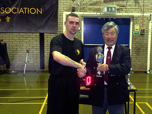 Padraig receiving his trophy from Master Yau at the BKFA Nationals