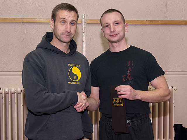 Arik receiving his Brown Sash from Sifu Derek Dawson