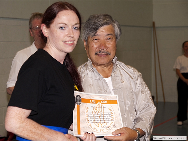 Stephanie Forte receiving her Orange Sash from Master Yau at the Summer Course