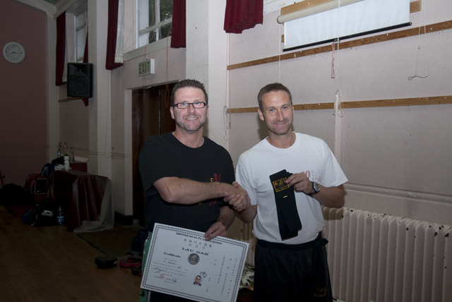 Simon receiving his Black Sash from Sifu Derek Dawson