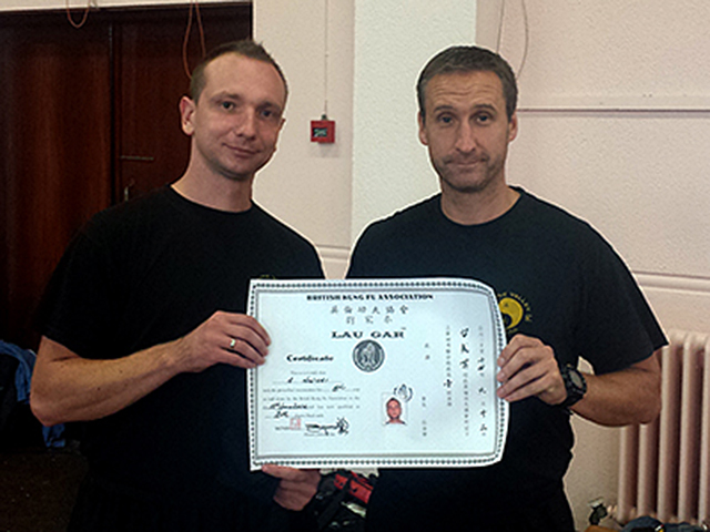 Arek receiving his Black Sash from Sifu Derek Dawson