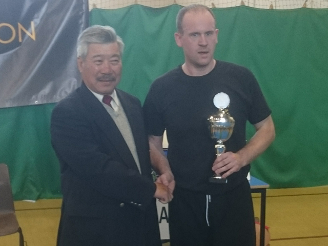 Ian at BKFA Nationals receiving trophy from Master Yau