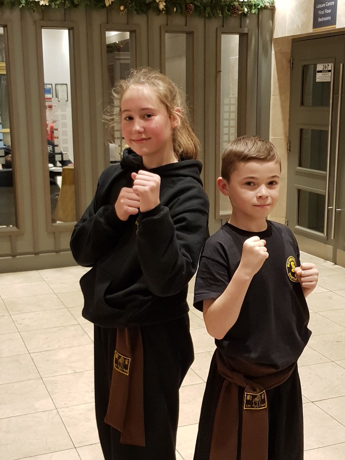 Katie and Aaron happy after passing their Brown Sash grading in December 2017