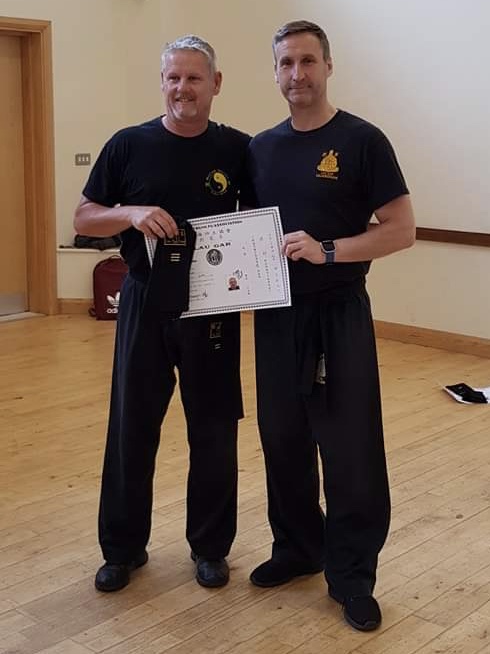 Warrick Bowler receiving his 3rd Degree Black Sash and Certificate from Sifu Derek Dawson.